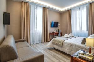 Postel nebo postele na pokoji v ubytování Hotel Genova