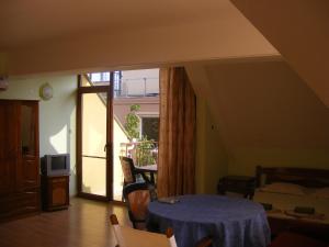 a room with a table with a blue table cloth on it at Guest House "Zora - Sarafovo" in Burgas