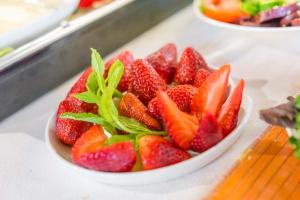 a bowl of strawberries sitting on a counter at Horta Da Coutada in Monsaraz