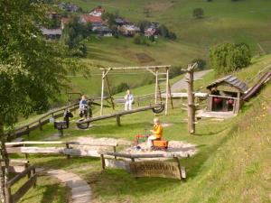 a group of people playing in a playground at Gästehaus Kehrwieder in Todtnau