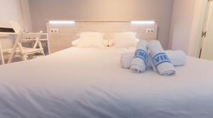 Cama o camas de una habitación en Hostal Viena