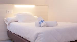 Postel nebo postele na pokoji v ubytování Hostal Viena