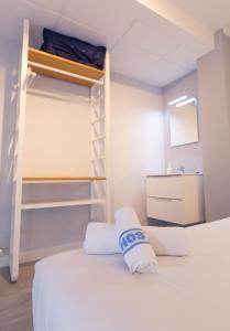Postel nebo postele na pokoji v ubytování Hostal Viena