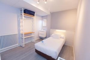 Postel nebo postele na pokoji v ubytování Hostal Viena