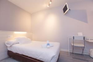 Postel nebo postele na pokoji v ubytování Hostal Viena