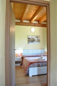 Postel nebo postele na pokoji v ubytování AGRITURISMO MELOGRANO D'ORO