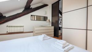 Ένα ή περισσότερα κρεβάτια σε δωμάτιο στο Italianway - Baiamonti 1