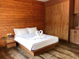 Postel nebo postele na pokoji v ubytování The Nest Samui