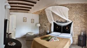 A bed or beds in a room at Dimore del Valentino