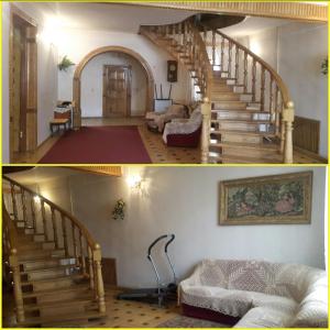 a living room with stairs and a room with a couch at Guli in Gori