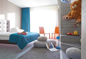 Postel nebo postele na pokoji v ubytování Kurshi Hotel & Spa