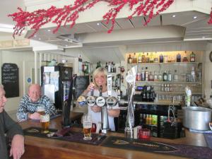 a man and a woman sitting at a bar at Wentworth arms in Malton