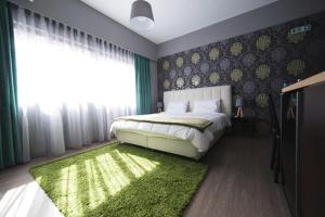 Ένα ή περισσότερα κρεβάτια σε δωμάτιο στο MARGARITA'S SUITES