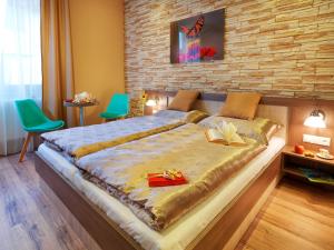 Postel nebo postele na pokoji v ubytování Hotel Viktor