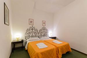 Postel nebo postele na pokoji v ubytování Hotel Rex
