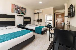Voodi või voodid majutusasutuse Hotel Genova Centro toas