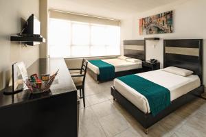 Voodi või voodid majutusasutuse Hotel Genova Centro toas