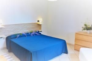 Postel nebo postele na pokoji v ubytování Baia Etrusca Resort