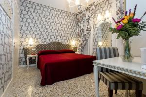 Posteľ alebo postele v izbe v ubytovaní Hotel Ca' Nobile Corner