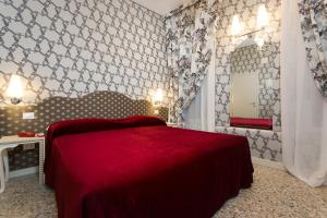 Posteľ alebo postele v izbe v ubytovaní Hotel Ca' Nobile Corner