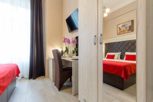 Ένα ή περισσότερα κρεβάτια σε δωμάτιο στο Belgrade City Hotel