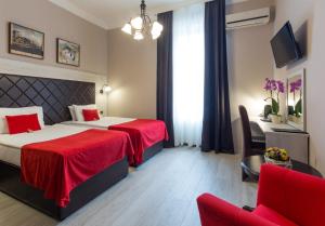 Ένα ή περισσότερα κρεβάτια σε δωμάτιο στο Belgrade City Hotel