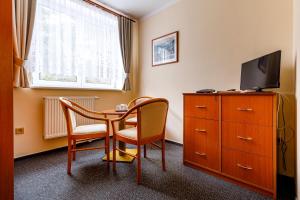 TV a/nebo společenská místnost v ubytování Hotel Jitřenka