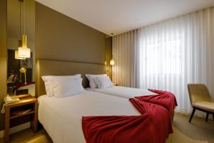 Postel nebo postele na pokoji v ubytování Hotel Regina