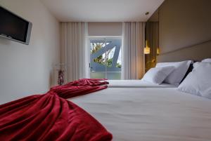 Postel nebo postele na pokoji v ubytování Hotel Regina