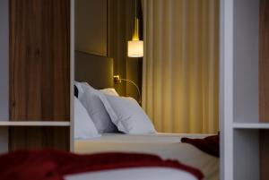 Postel nebo postele na pokoji v ubytování Hotel Regina