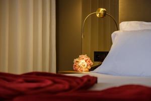 Postel nebo postele na pokoji v ubytování Hotel Regina