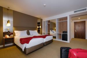 Postel nebo postele na pokoji v ubytování Hotel Regina