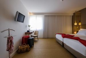 Postel nebo postele na pokoji v ubytování Hotel Regina