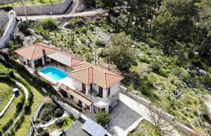an overhead view of a house with a swimming pool at Villa Antalya Esiyok in Antalya