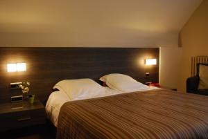 Postel nebo postele na pokoji v ubytování Hotel Rubens