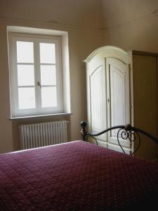 Postel nebo postele na pokoji v ubytování Relais Villa Sensano