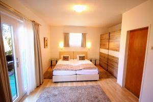 Postelja oz. postelje v sobi nastanitve Hotel Rösch