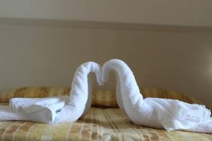 Łóżko lub łóżka w pokoju w obiekcie Hotel Al Bosco