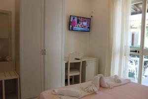 Łóżko lub łóżka w pokoju w obiekcie Hotel Al Bosco