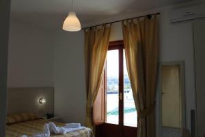 Łóżko lub łóżka w pokoju w obiekcie Hotel Al Bosco