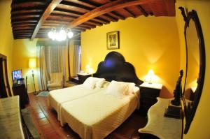 Posteľ alebo postele v izbe v ubytovaní Hotel Emblemático San Marcos