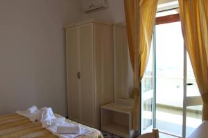 Łóżko lub łóżka w pokoju w obiekcie Hotel Al Bosco