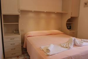 Łóżko lub łóżka w pokoju w obiekcie Hotel Al Bosco