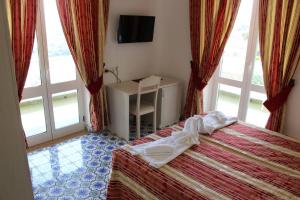 Łóżko lub łóżka w pokoju w obiekcie Hotel Al Bosco