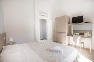 Een bed of bedden in een kamer bij Cefalù In Casa