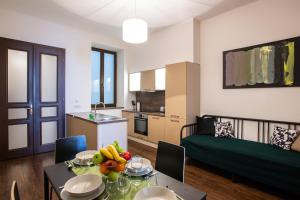 a living room with a table with fruit on it at Modern family apt. with Central Square entrance in Hradec Králové