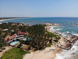 an aerial view of a resort on the beach at Turtle Bay Boutique Hotel in Tangalle