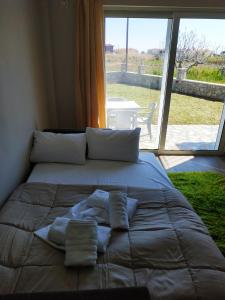 A bed or beds in a room at Lighthouse Apartments
