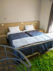 A bed or beds in a room at Lighthouse Apartments