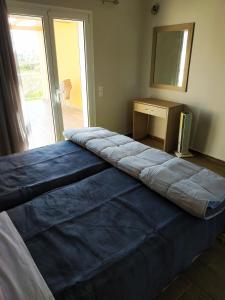 A bed or beds in a room at Lighthouse Apartments